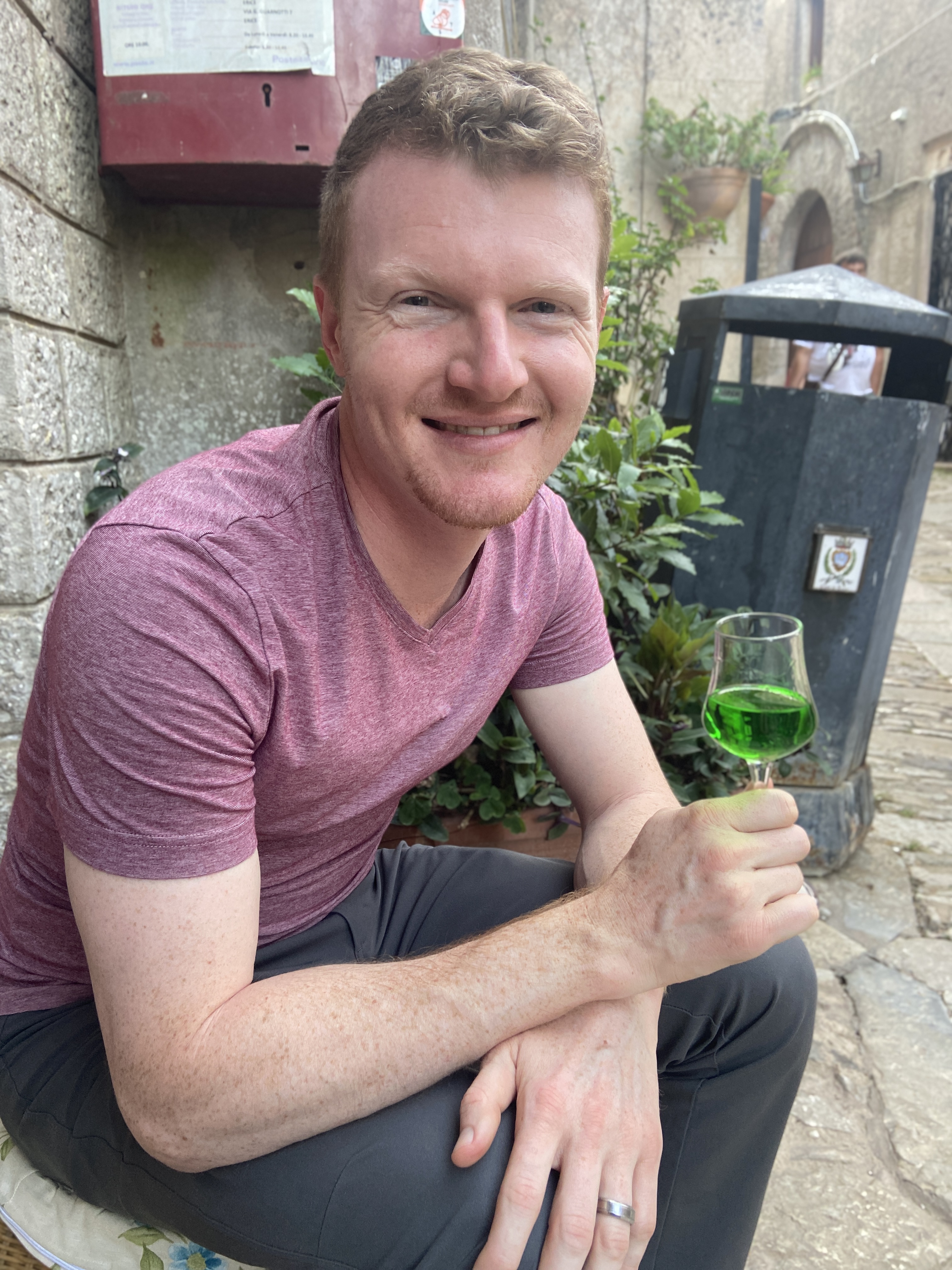 Brett drinking a digestivo in erice sicily from Aplins in the Alps