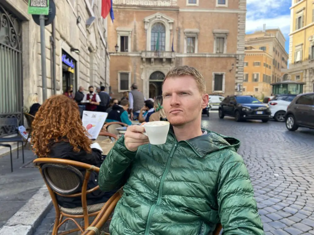 Brett aplin drinking coffee in Rome by aplins in the alps