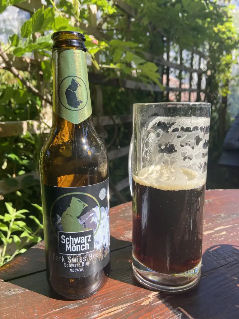 schwarz monch beer dark swiss beer number one dark lager pension gimmelwald switzerland aplins in the alps