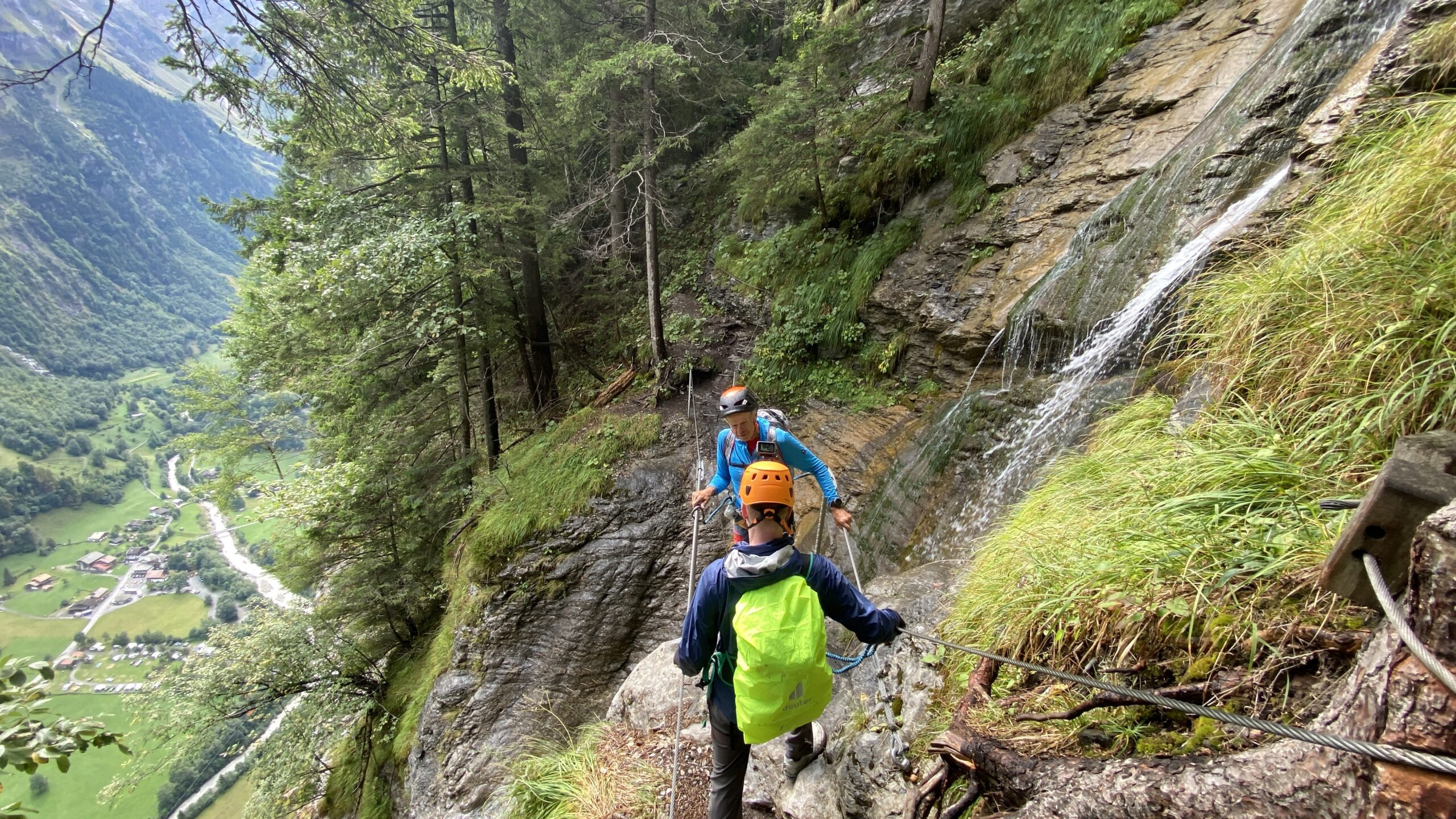 Via ferrata Mürren guide crossing the tightrope over a waterfall