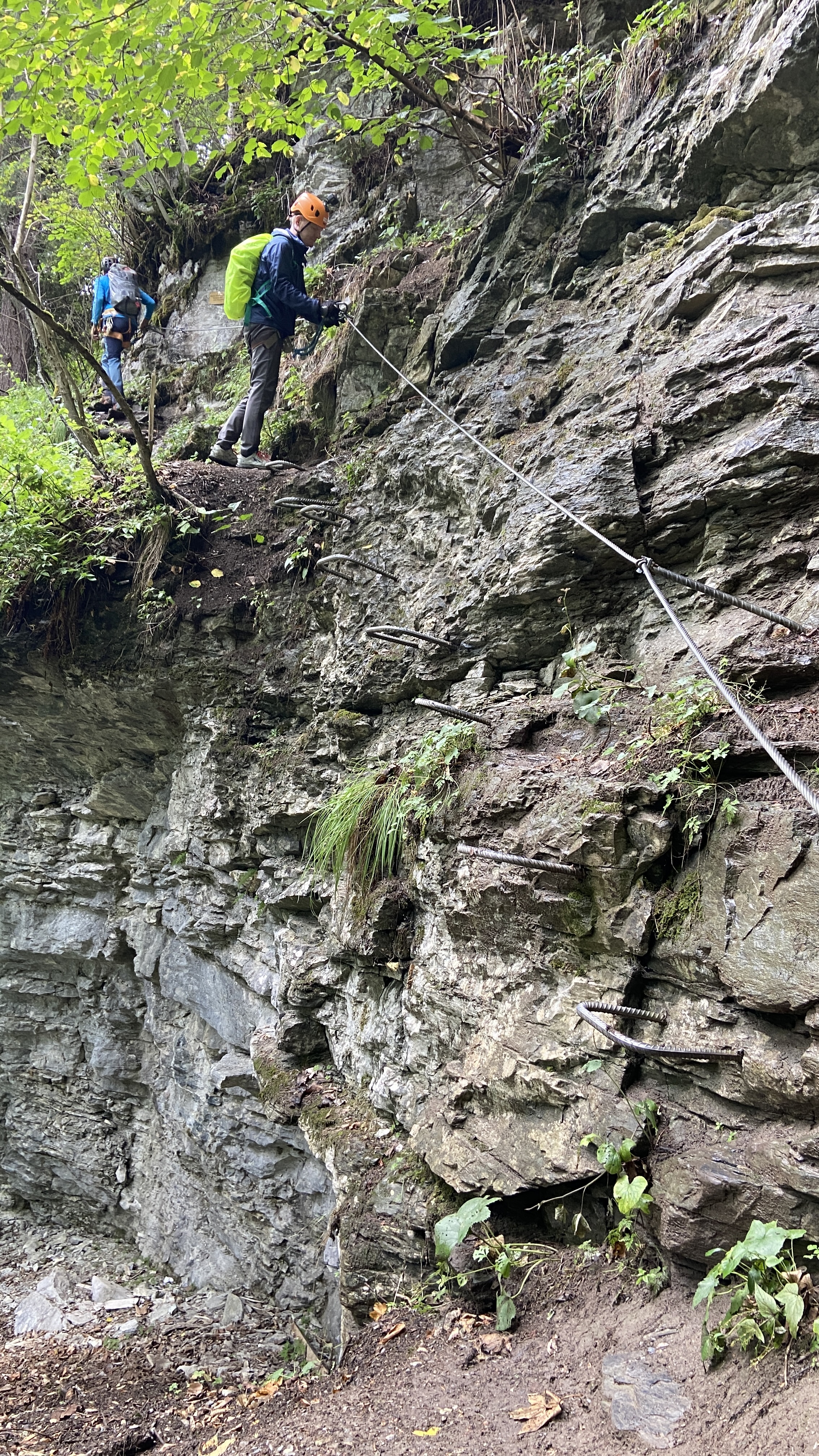 Brett climbing the iron rungs on the murren via ferrata