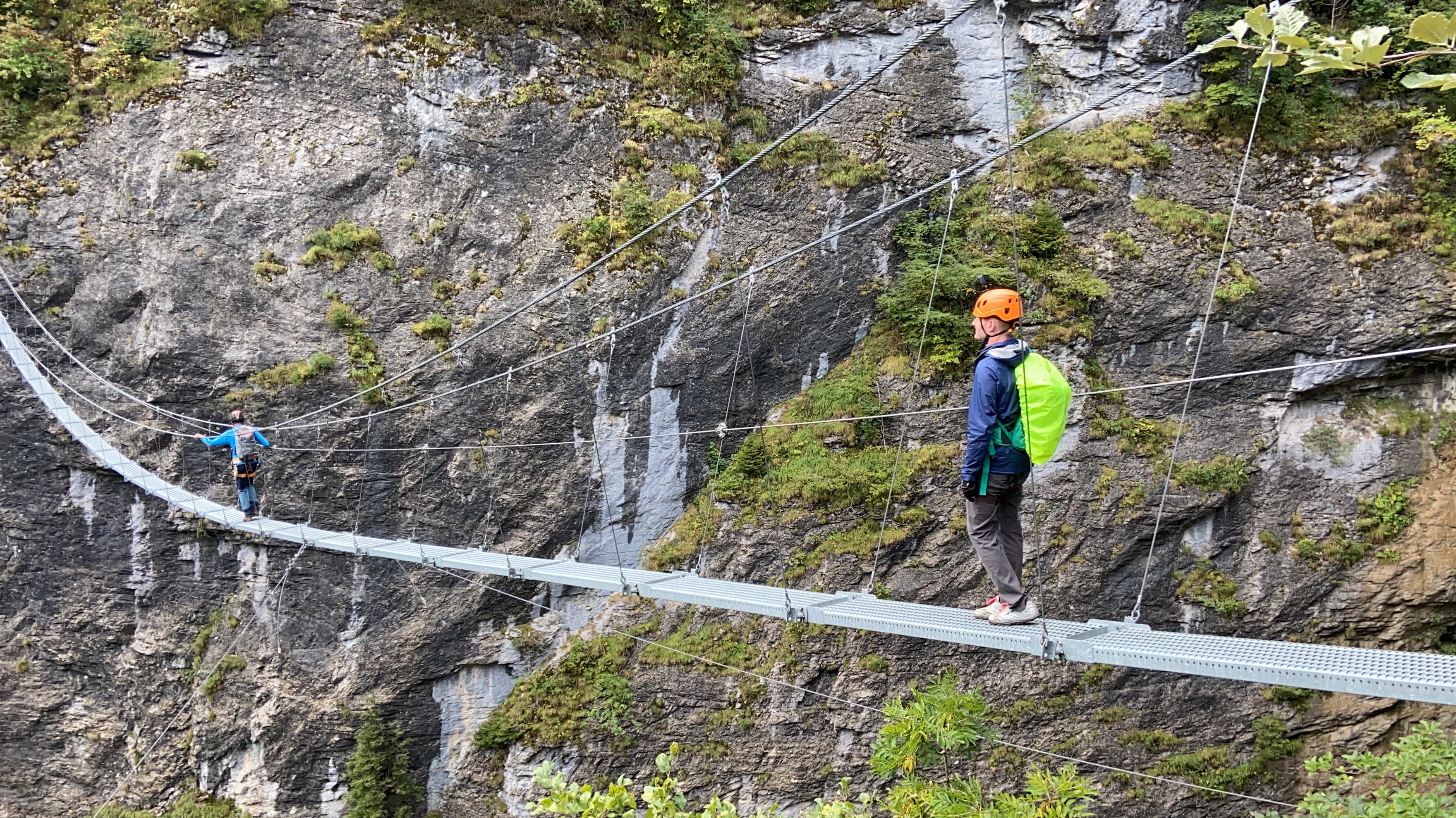 Brett from Aplins in the Alps standing on a via ferrata suspension bridge  between murren switzerland and gimmelwald switzerland