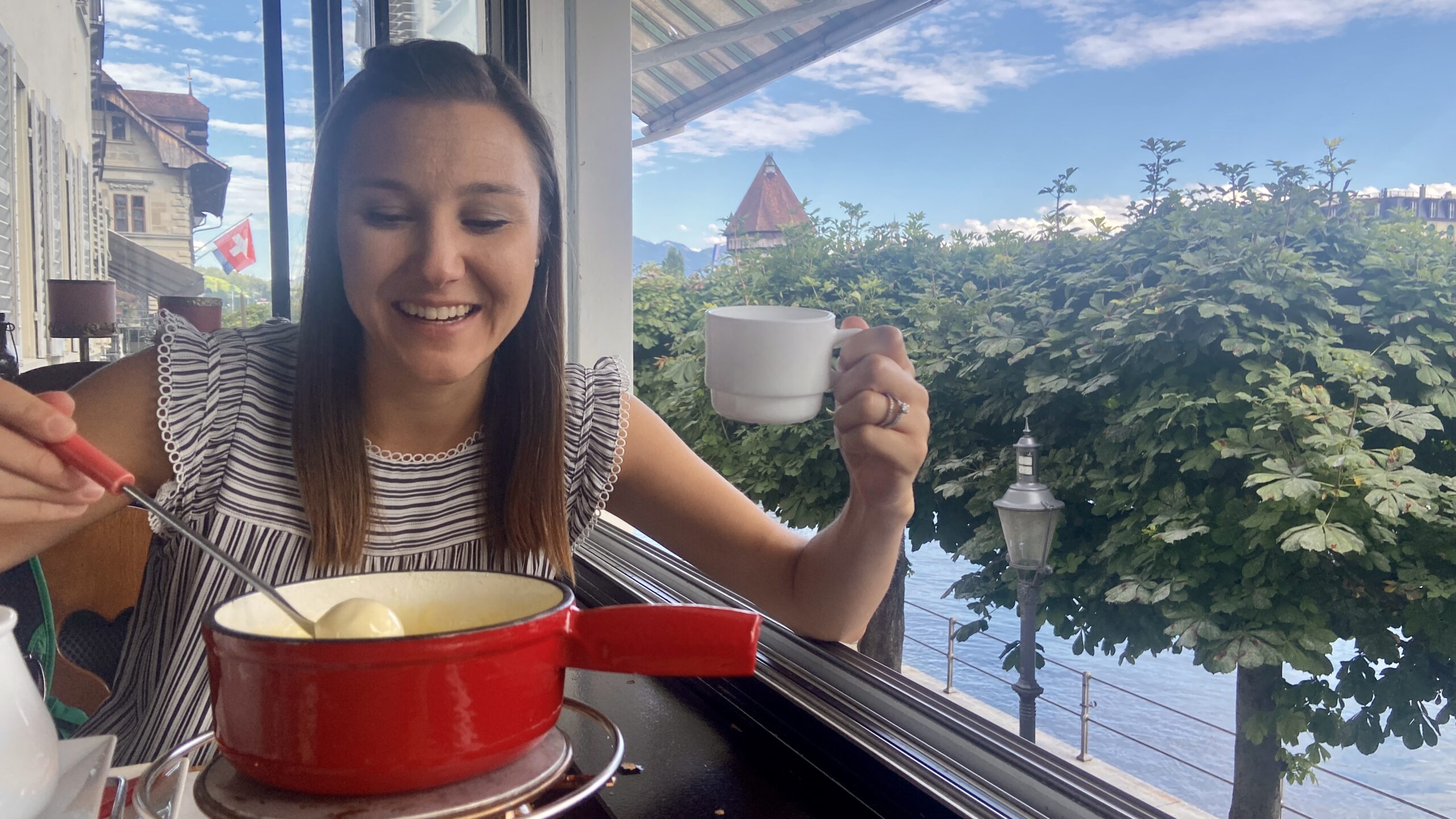 Jana eating Swiss fondue at fondue house du pont lucerne switzerland