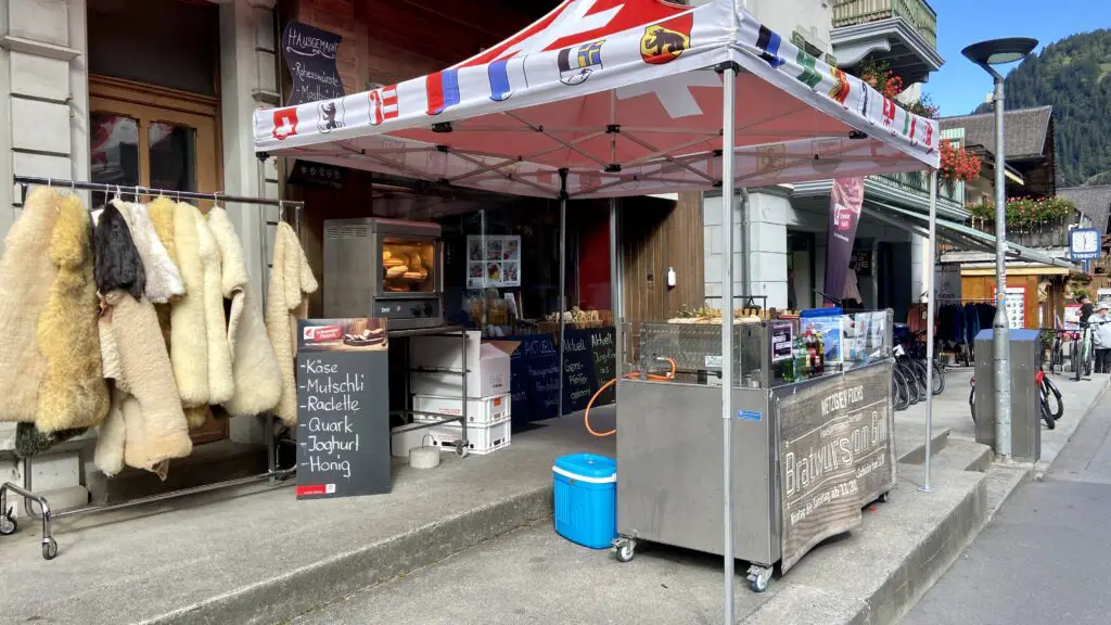 Metzgerei Fuchs in Lauterbrunnen Switzerland with a grill and bratwurst out front