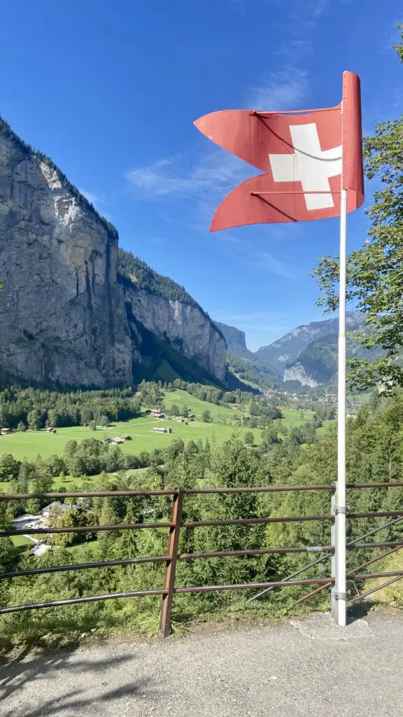 View of the Lauterbrunnen Valley with the Swiss Flag from Trummelbach Falls