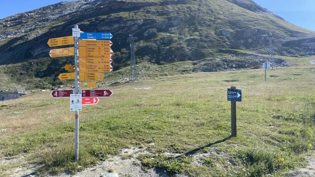 hiking-in-switzerland-trail-sign-with-blue-trails