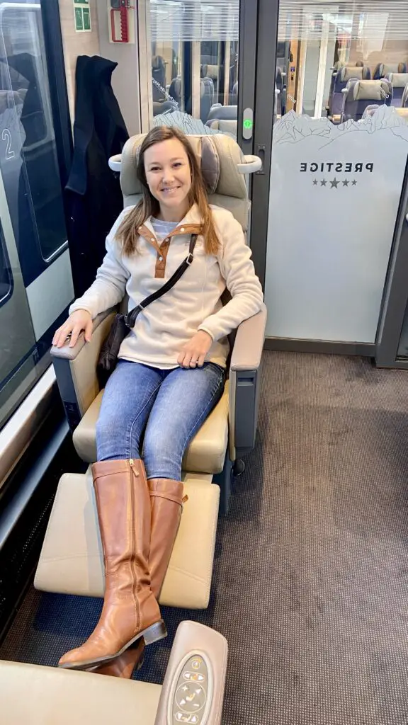 jana sitting with her feet up on the goldenpass express prestige class swivel chair