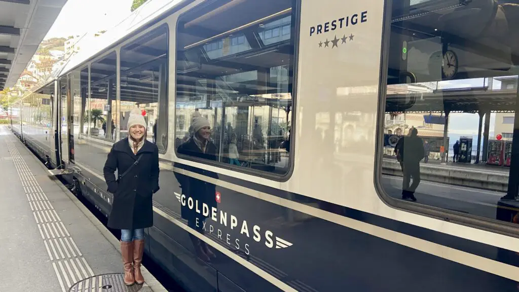 jana in front of goldenpass express train in switzerland