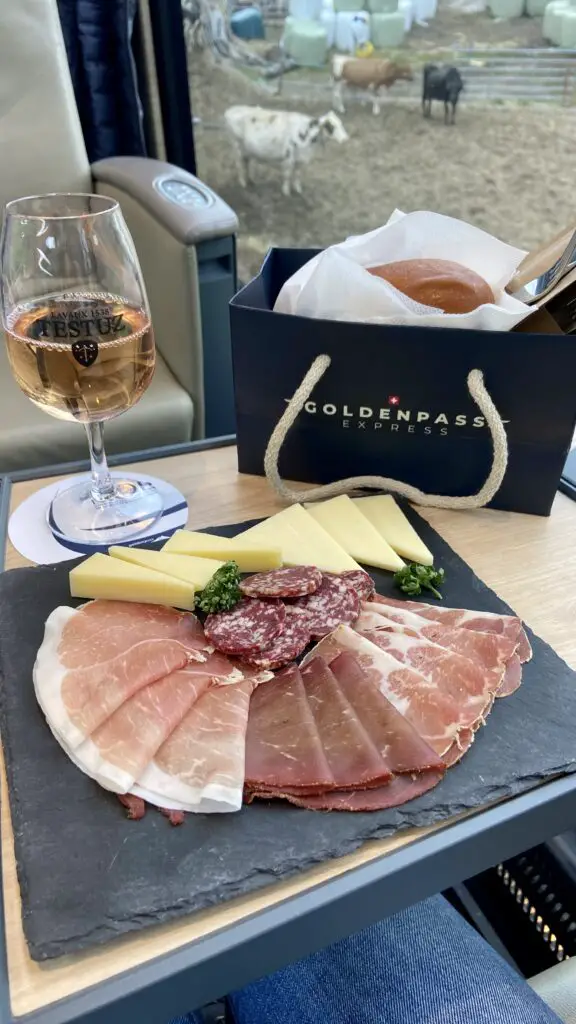goldenpass express apero platter with swiss cheese and meat and swiss wine
