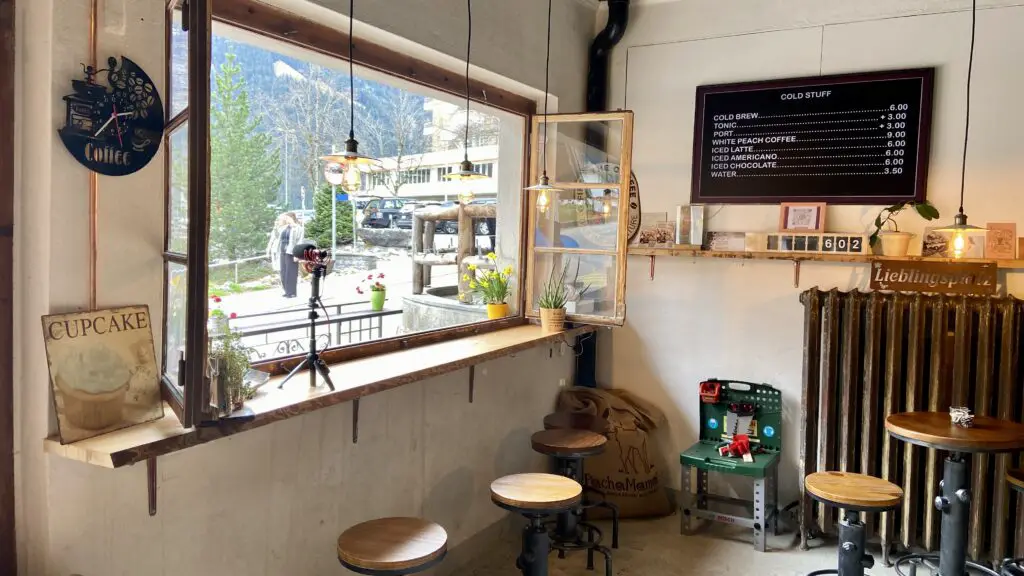 seating in front of the window at eigerbean coffee roaster in grindelwald switzerland