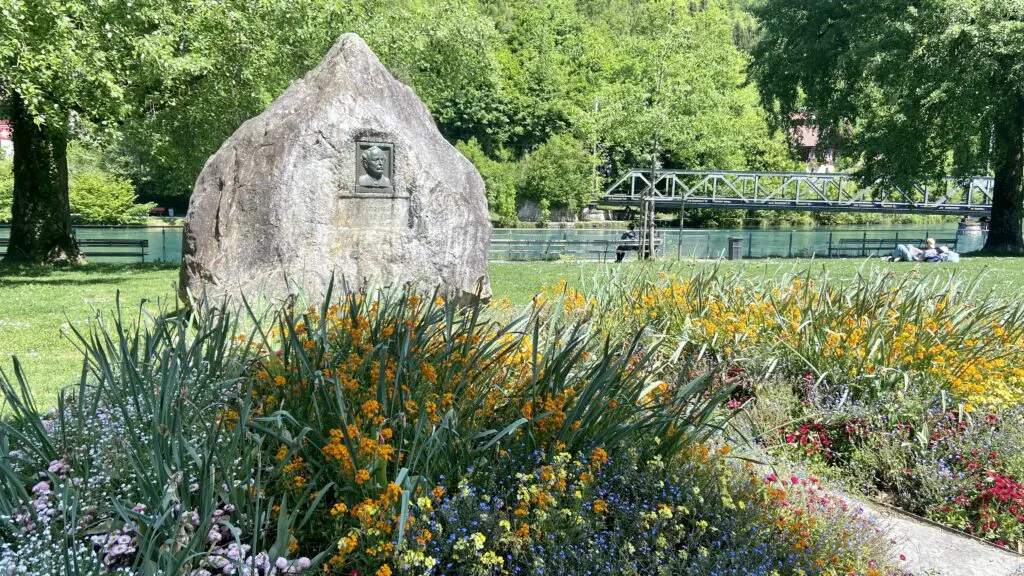 statue of denkmal adolf guyer zeller founder of jungfrau railways in a park in interlaken switzerland