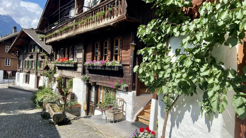 wooden swiss chalets and green vines on the second most beautiful street in the world brunngasse switzerland brienz