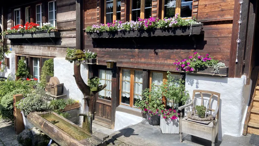 wooden swiss chalets and window flower boxes on the second most beautiful street in the world brunngasse switzerland brienz