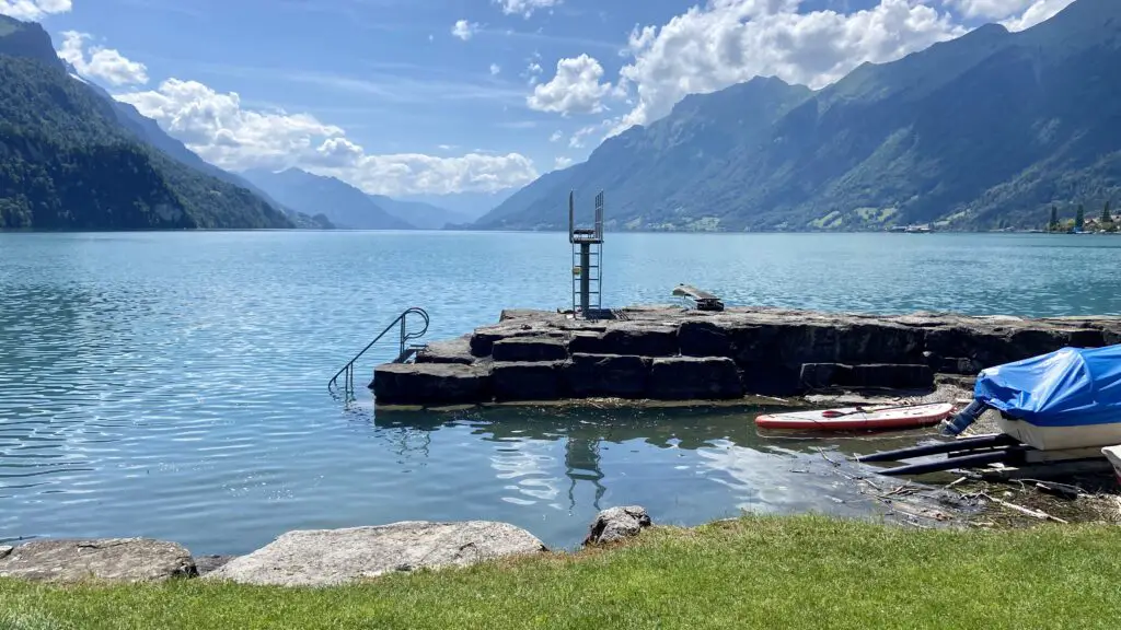 canoes and boat dock at brienz strandbad on lake brienz