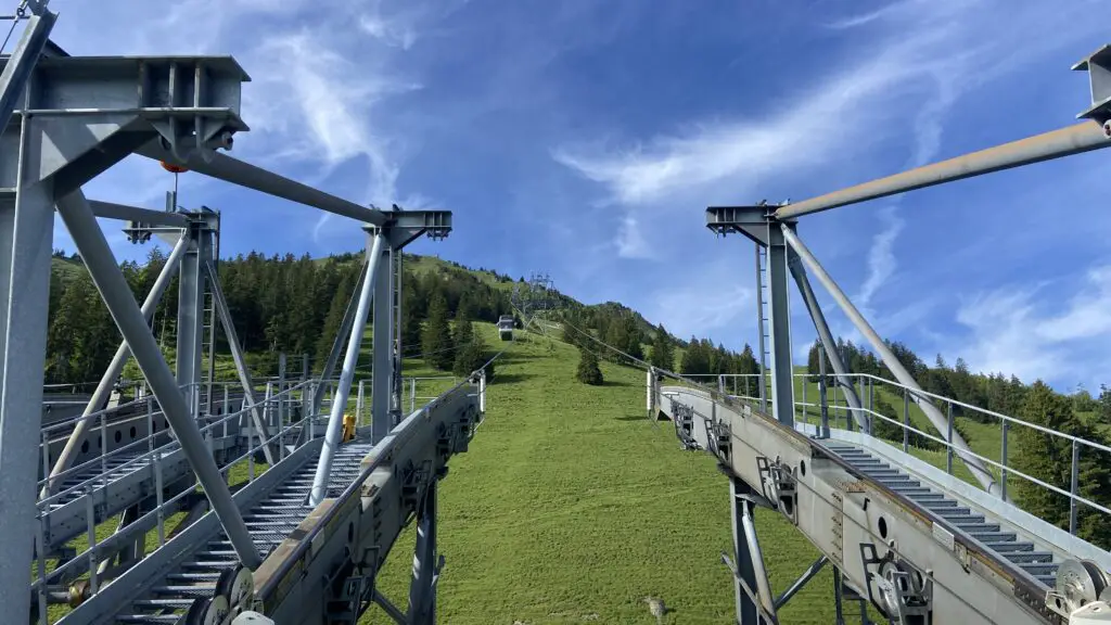 riding the stanserhorn cabrio cable car looking up to the stanserhorn station