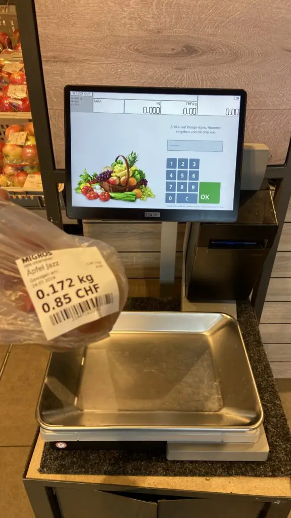 produce scale in migros grocery store in switzerland