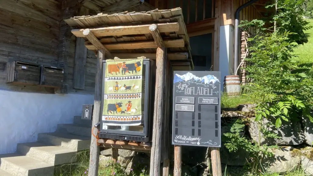 self service farm fridge with swiss cheese and swiss sausage in isenfluh switzerland lauterbrunnen