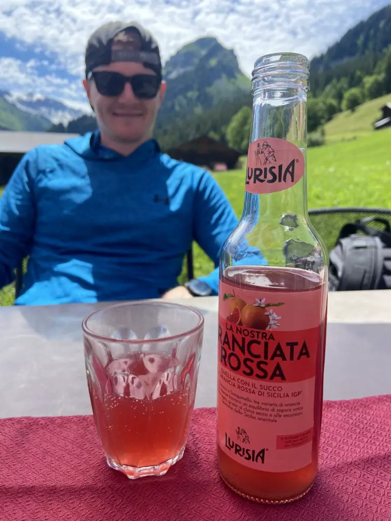 brett drinking a lemonade at restaurant sulwald stübli