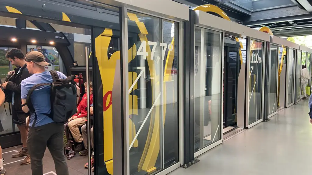 boarding the stoosbahn steepest funicular in the world