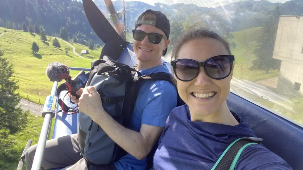 jana and brett aplins in the alps riding the charilift in the swiss alps to klingenstock