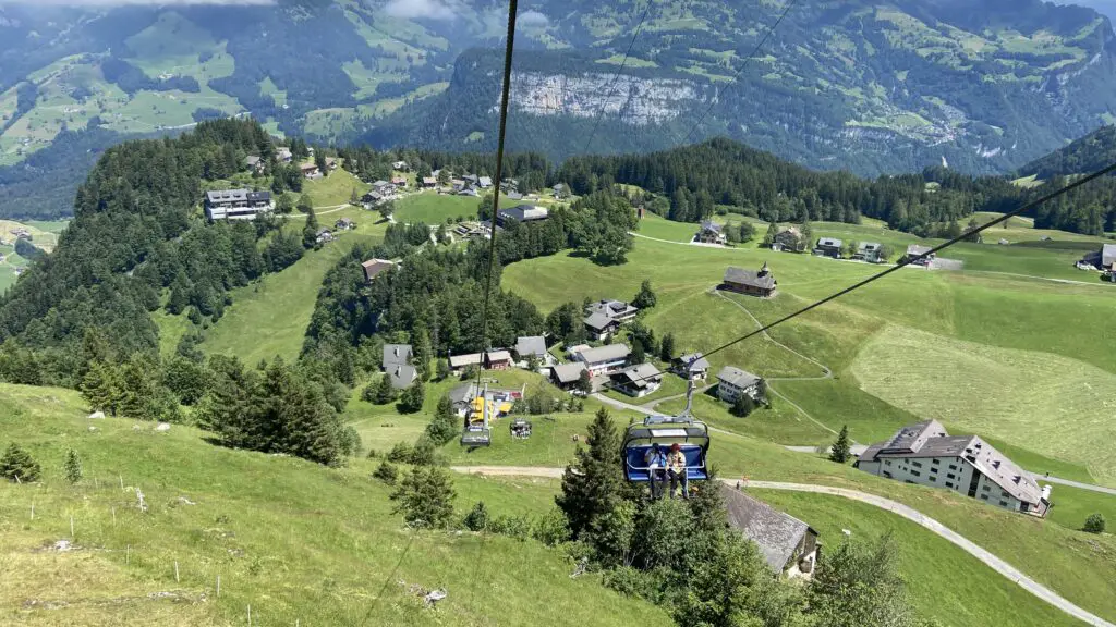 chairlift from fronalpstock to stoos switzerland with views of stoos village