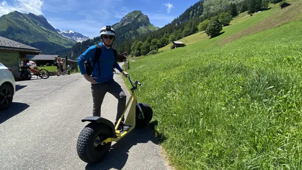 brett riding on a trottibike mountain scooters in sulwald switzerland