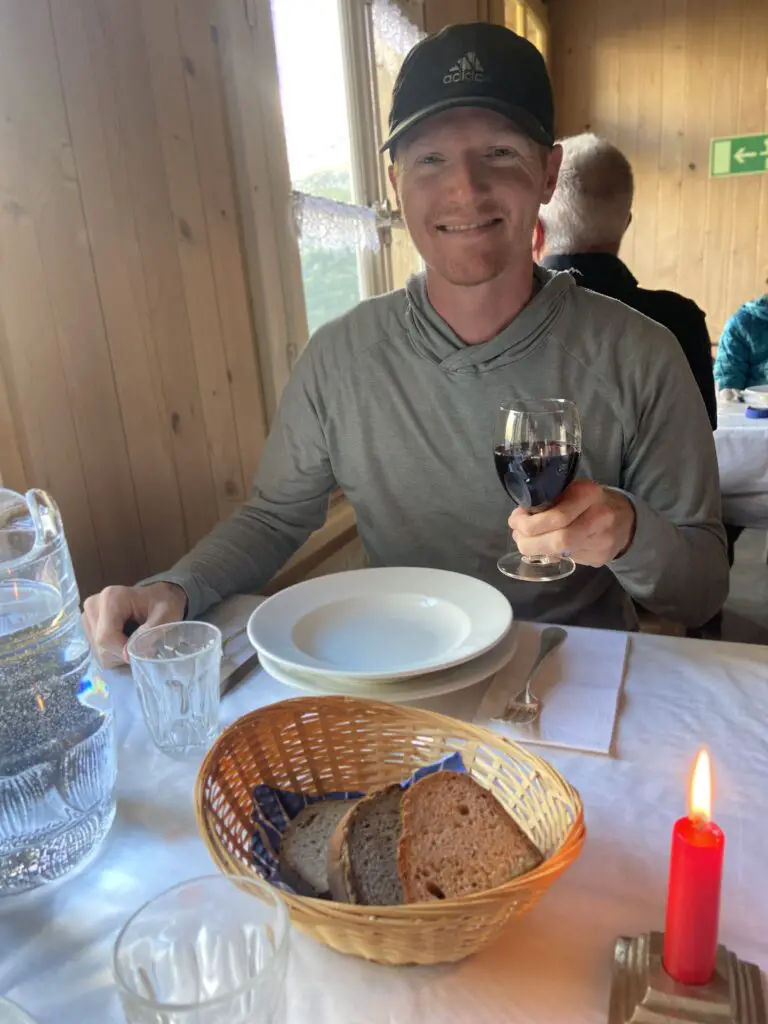 brett with a glass of wine at dinner at restaurant hotel obersteinberg switzerland