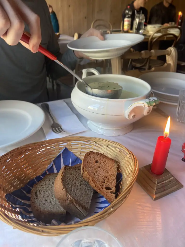 candlelight dinner with soup and bread at restaurant hotel obersteinberg switzerland