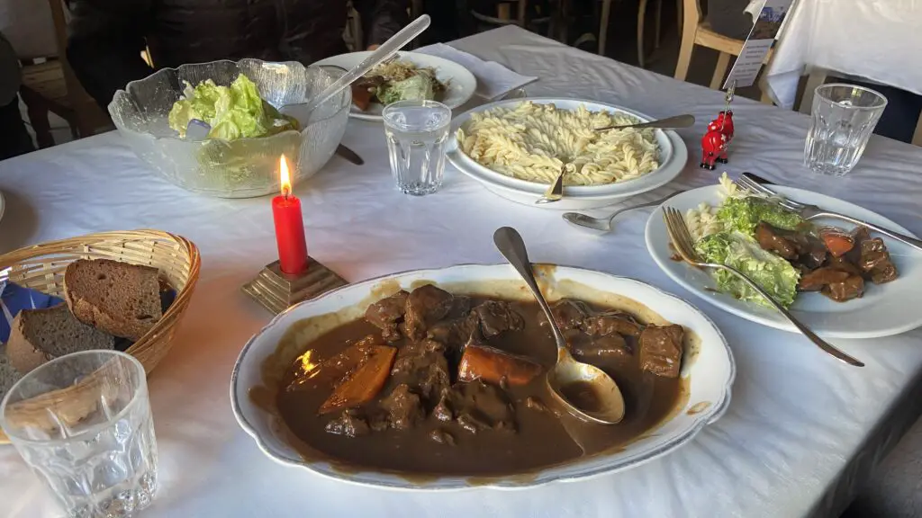 candlelight dinner with beef and pasta at restaurant hotel obersteinberg switzerland