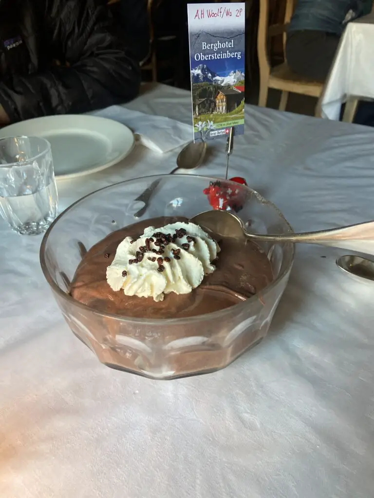 candlelight dinner with chocolate pudding and pears at restaurant hotel obersteinberg switzerland