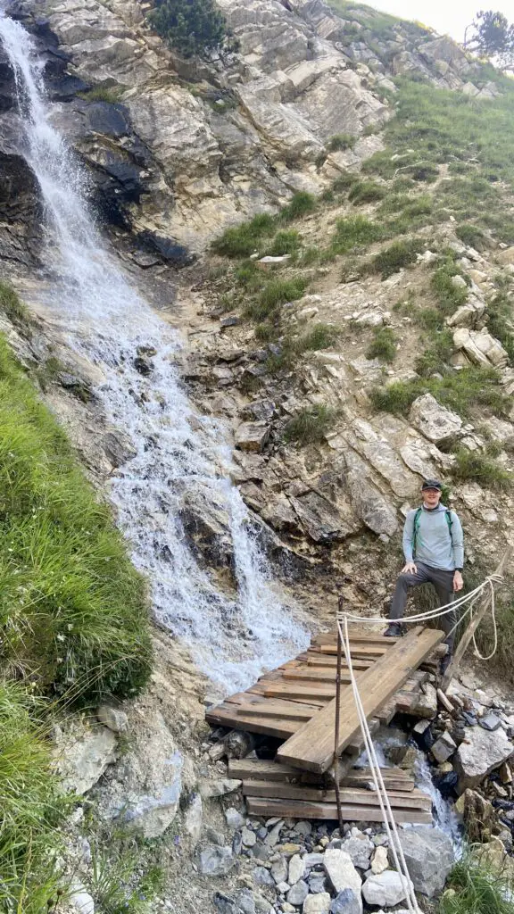 brett by a waterfall on the trail to oberhornsee switzerland