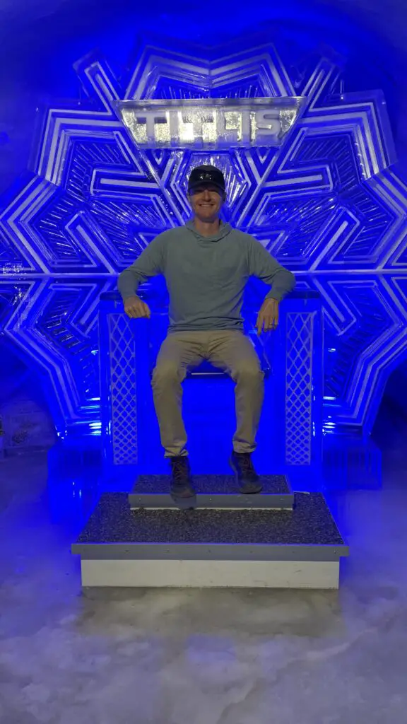 brett aplin from aplins in the alps sitting on the ice chair in the titlis glacier cave