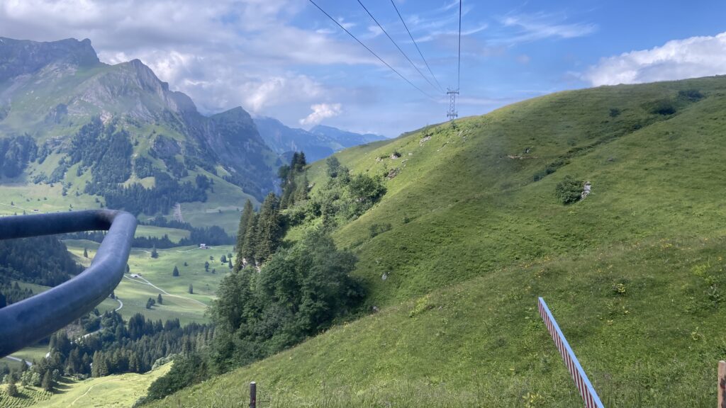 riding a small farmers cable car down from trübsee