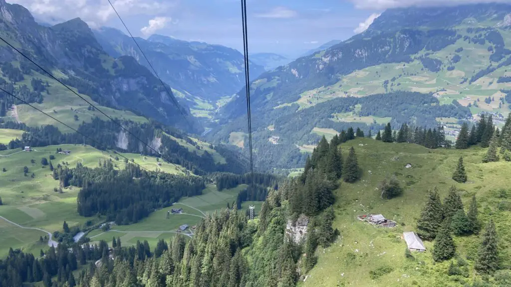 views of engelberg while riding a small farmers cable car down from trübsee