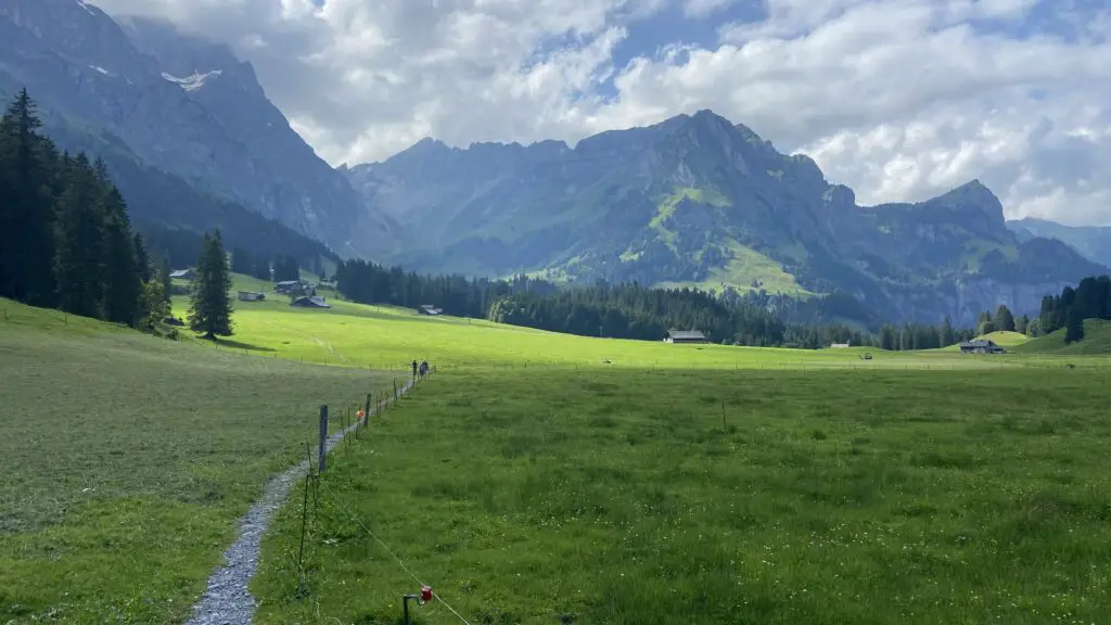 the trail through green fields from untertrübsee to gerschnialp