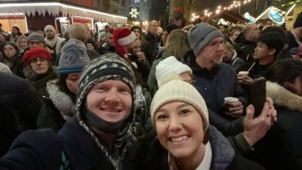 jana and brett aplins in the alps at zurich singing christmas tree