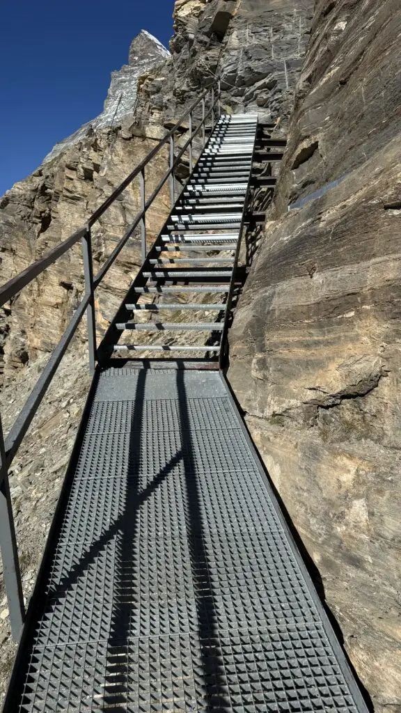 staircase on the trail to the hornli hut in zermatt switzerland with the matterhorn in the background