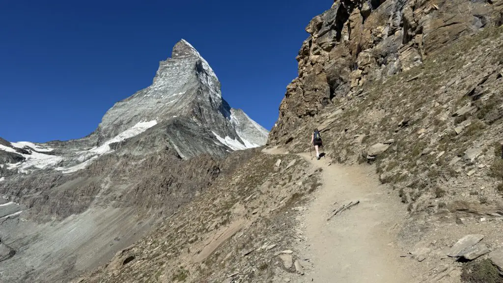 Hiking in zermatt along the trail to the hornli hut with a view of the matterhorn