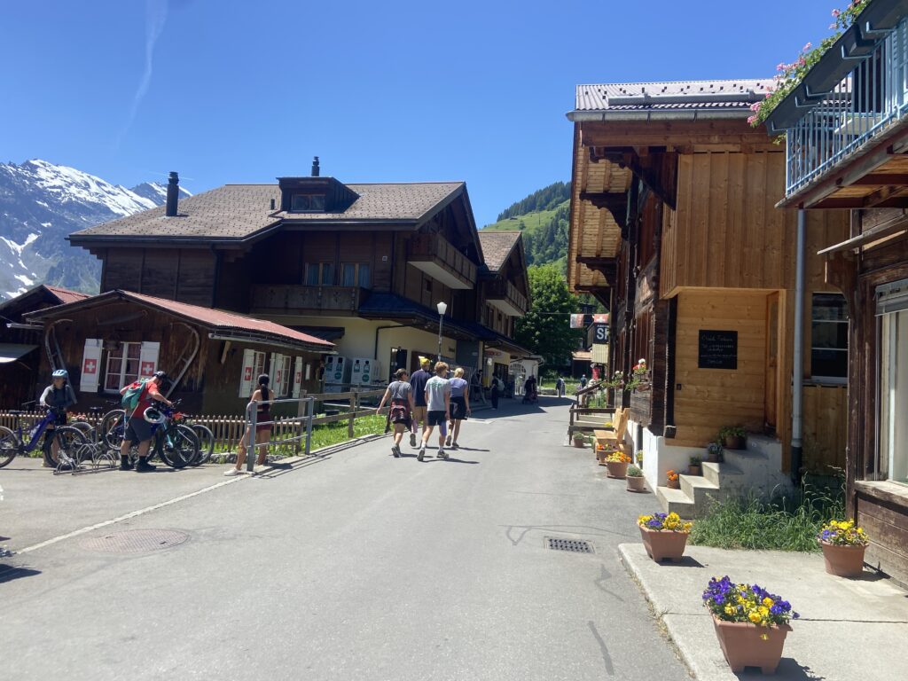 walking down the main street of murren switzerland in the swiss alps
