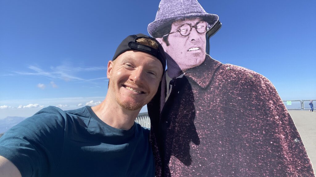 brett posing with james bond at the schilthorn switzerland